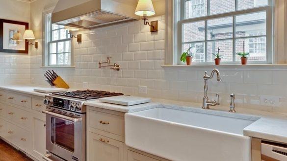 A white backsplash can reflect light to create a clean, bright vibe in your  bathroom