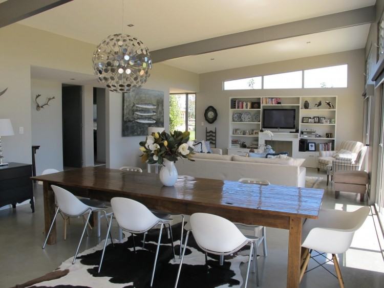 Craftsman style dining room with a gorgeous area rug [Design: Garrison  Hullinger Interior Design