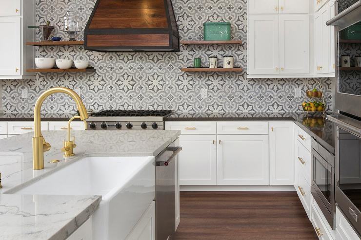 This backsplash shows how contrasting patterns and materials can create a  beautiful focal point