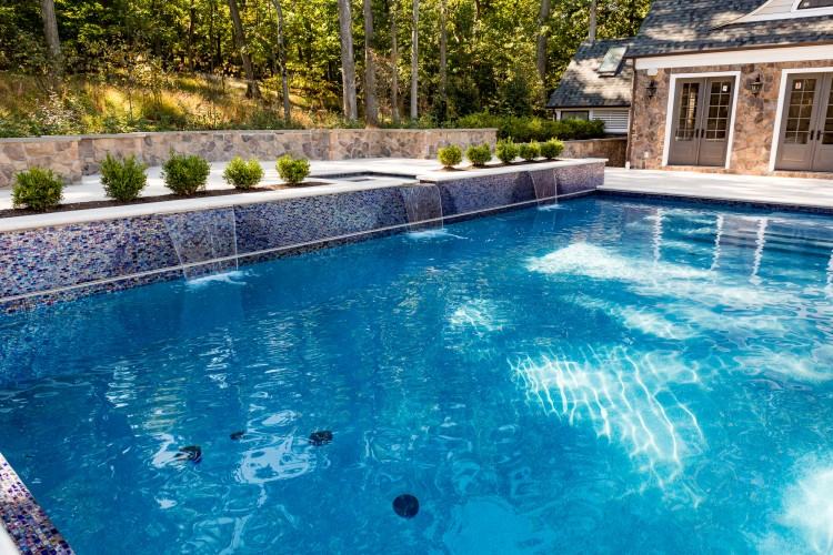 NJ Inground Swimming Pool with Landscaping, Patio, Grotto, Waterfalls, and  Underground SlideSaddle River, NJ landscape design includes luxury features  such